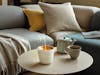 Zoe mobile aroma diffuser in white on a coffee table
