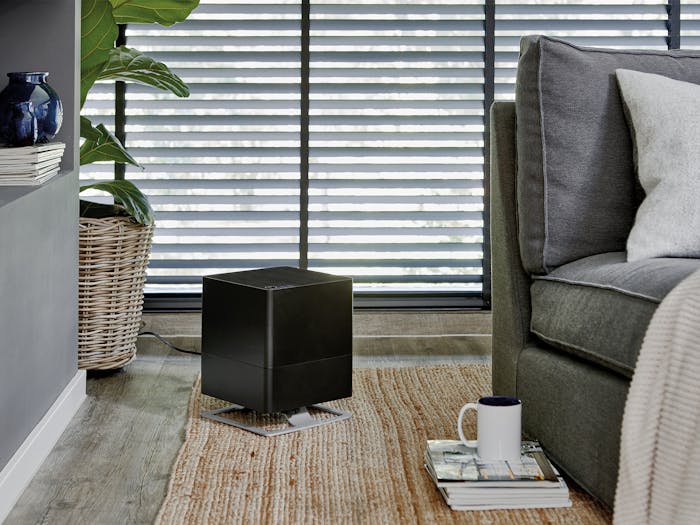 Oskar humidifier by Stadler Form in black Oskar humidifier by Stadler Form in black next to a couch