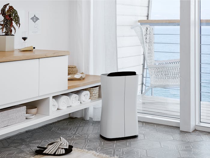 Theo dehumidifier by Stadler Form in a bathroom