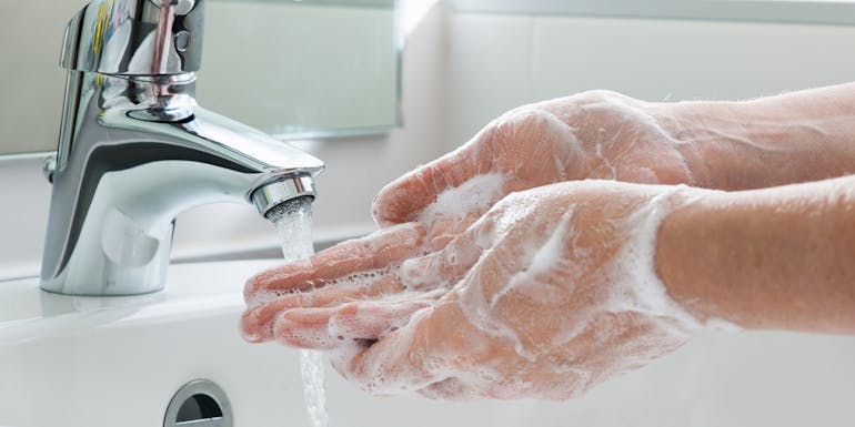 Woman washing hands with soap Woman washing hands with soap