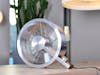 Q design fan by Stadler Form on a table