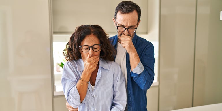 Couple with allergies sneezing Couple with allergies sneezing
