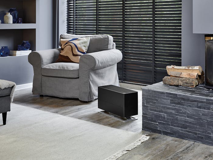 Oskar big humidifier by Stadler Form in black Oskar big humidifier by Stadler Form in black in living room with a fireplace