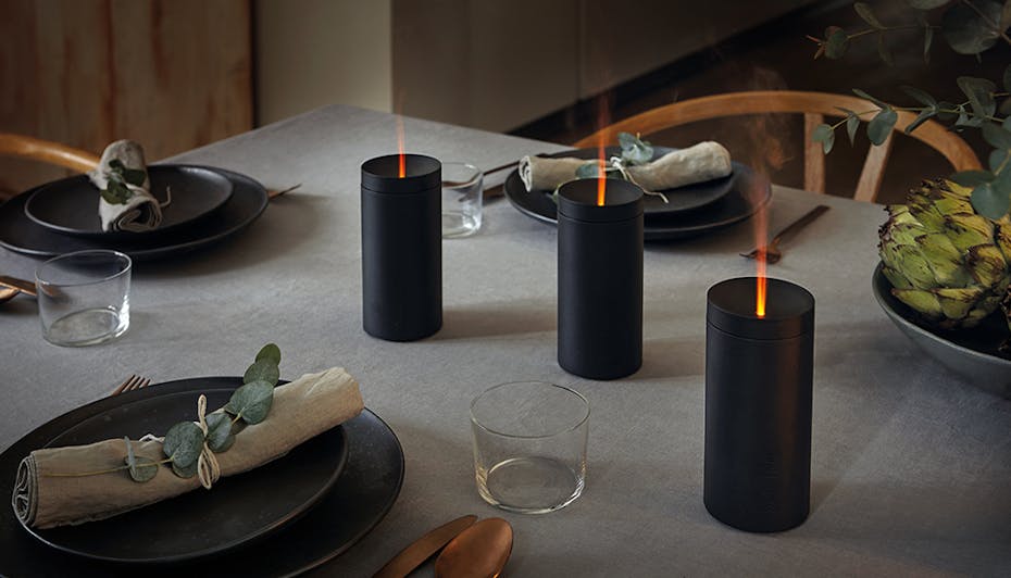 Aroma diffuser Lucy in black by Stadler Form as decoration on a dining table