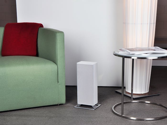 Anna heater by Stadler Form in white in a living room