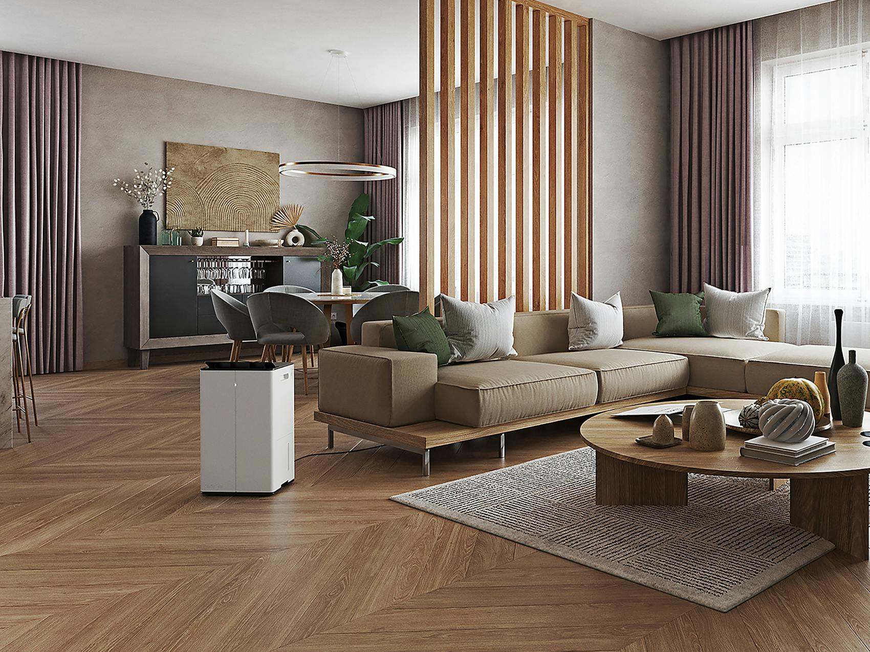 Dehumidifier Lukas Pro in an open living room with large windows next to a sofa