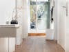 Roger little air purifier by Stadler Form in white Roger little air purifier by Stadler Form in white in a hallway