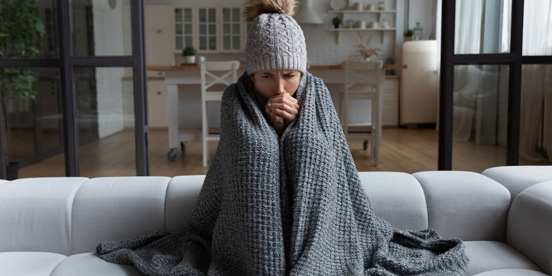 Woman freezing in apartment