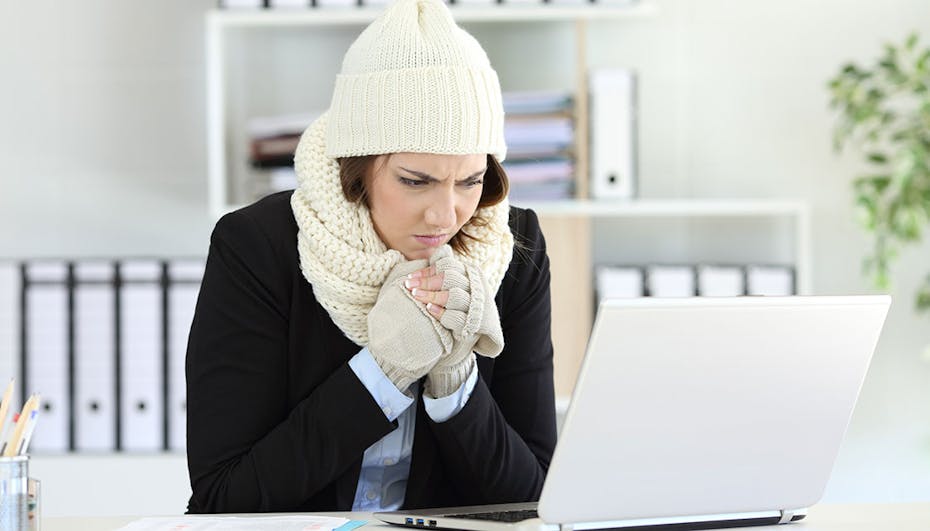 woman freezing in office