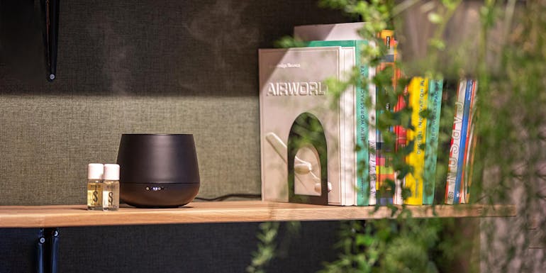 Aroma diffuser Julia in black with essential oils by Stadler Form on a bookshelf Aroma diffuser Julia in black with essential oils by Stadler Form on a bookshelf