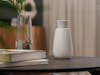 Aroma diffuser Ella by Stadler Form in a warm living room area on a table close up image