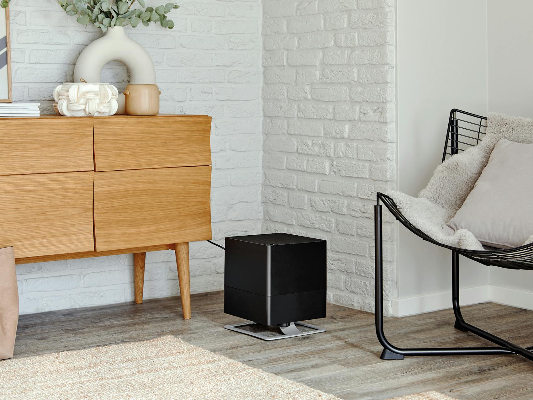 Oskar humidifier by Stadler Form in black Oskar humidifier by Stadler Form in black in a modern living room