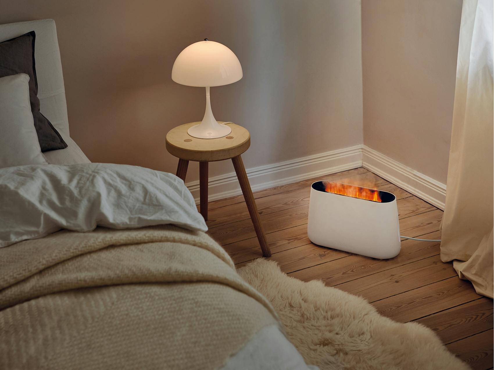 Ben humidifier by Stadler Form in white in a bedroom