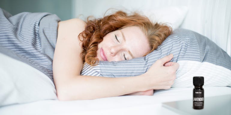 Sleeping woman with lavender essential oil Sleeping woman with lavender essential oil