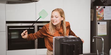 women catches insect