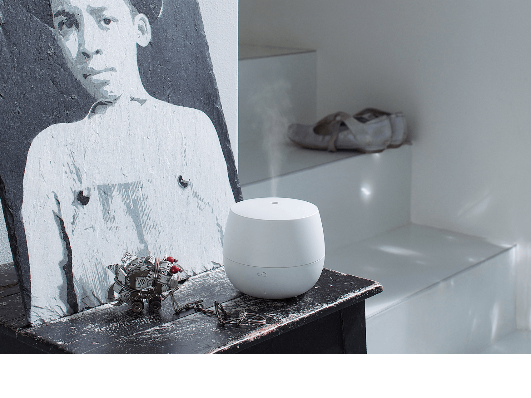 Mia aroma diffuser by Stadler Form in white on a sidebaord