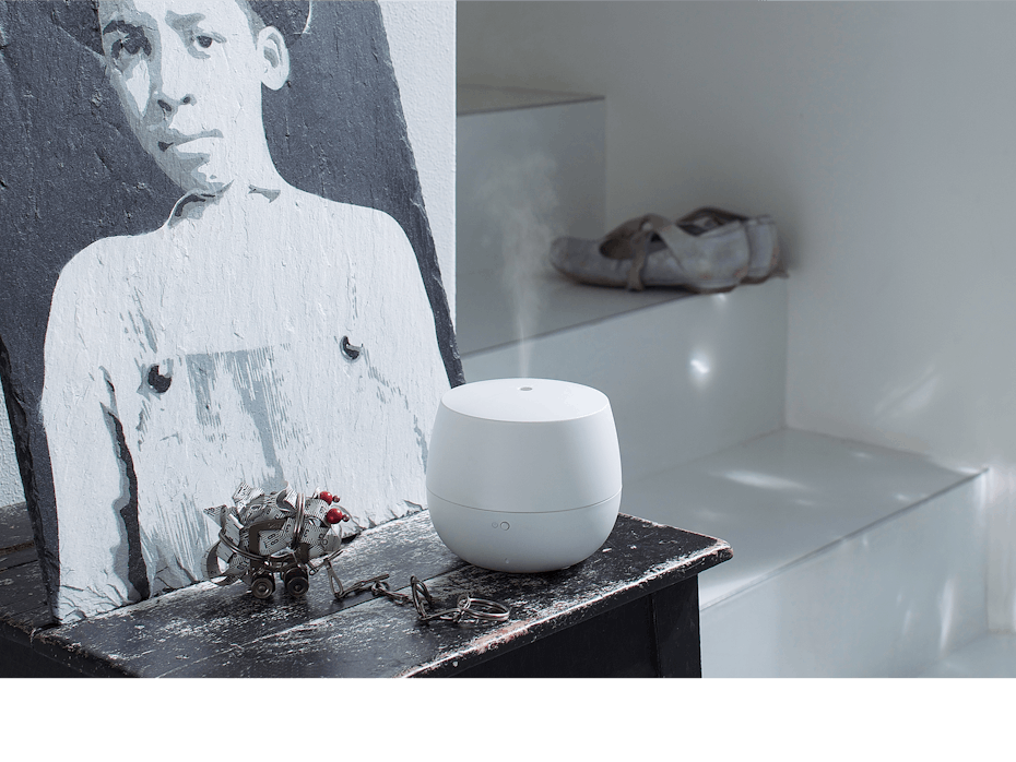 Mia aroma diffuser by Stadler Form in white on a sidebaord