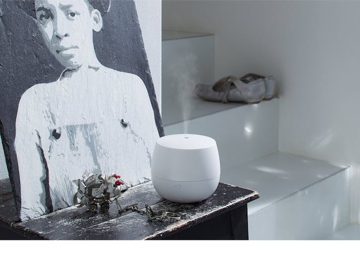 Mia aroma diffuser by Stadler Form in white on a sidebaord