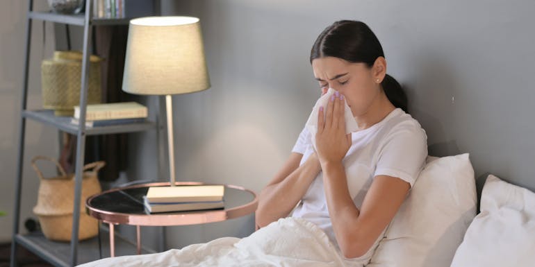 Girl with allergy sits on the bed Girl with allergy sits on the bed