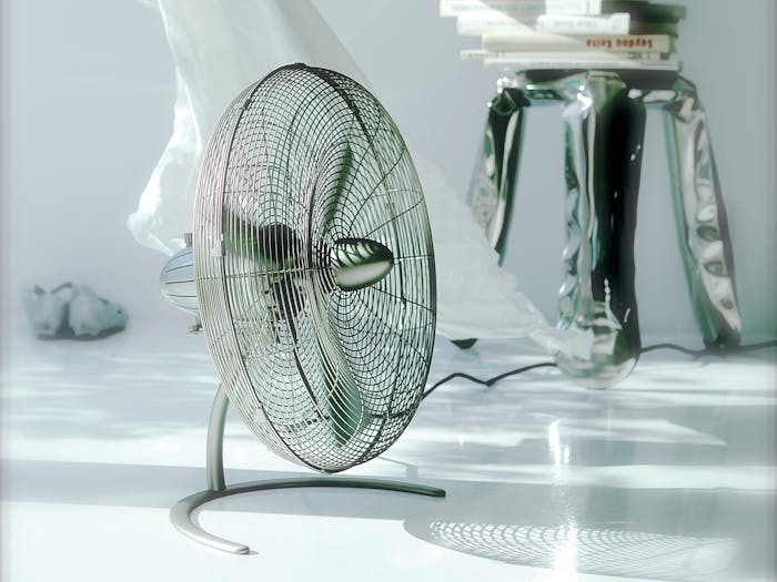 Charly floor fan by Stadler Form next to a curtain