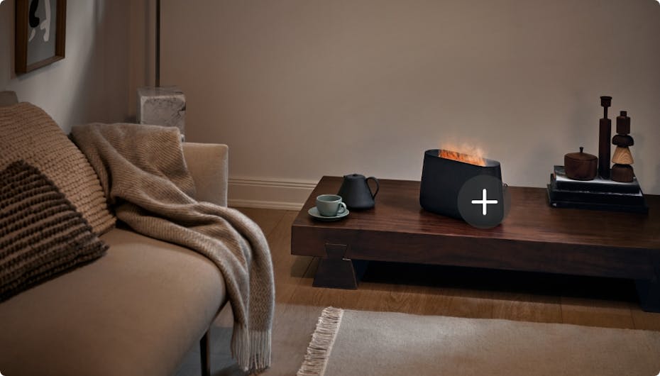 Stadler Form Ben humidifier in black with fireplace effect in a livingroom