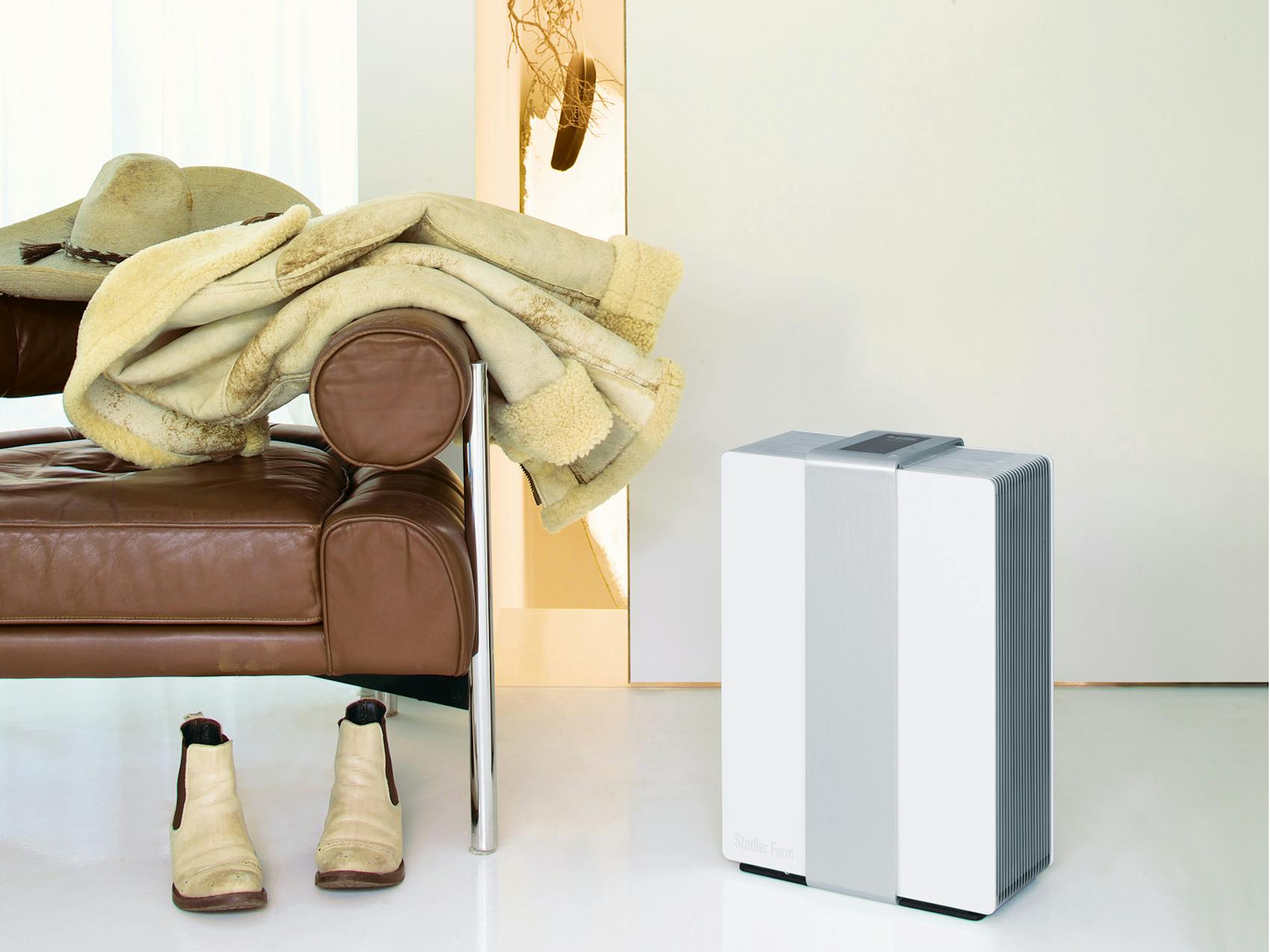 Robert air washer by Stadler Form in silver Robert air washer by Stadler Form in silver next to an armchair