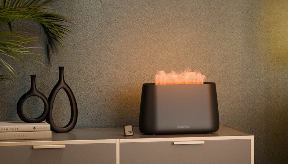 Ben humidifier in black from Stadler Form on a sideboard in a dark environment