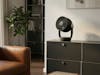 Stadler Form Leo fan in black, on a black sideboard