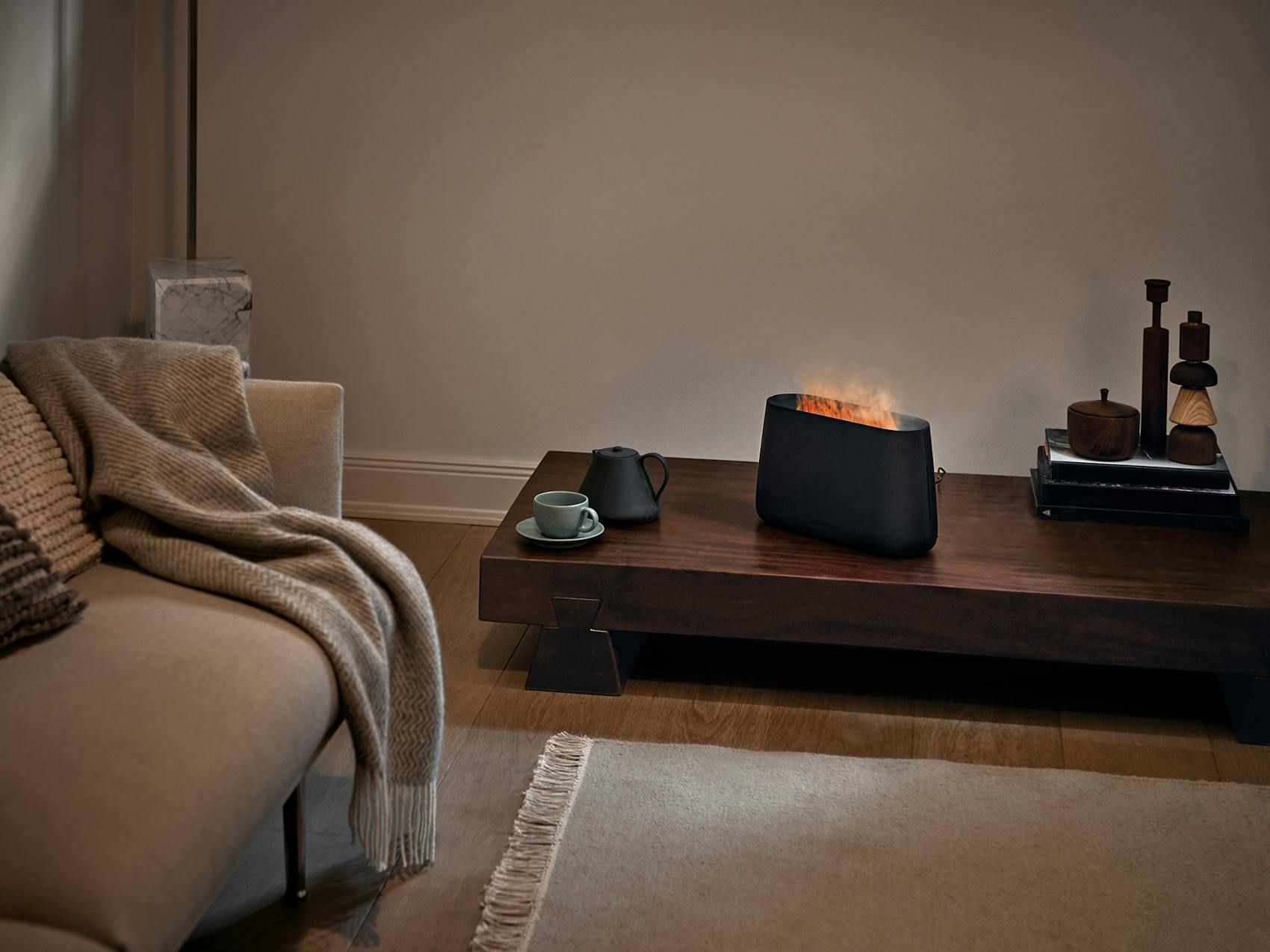 Ben humidifier by Stadler Form in black Ben humidifier by Stadler Form in black on a side table in a living room
