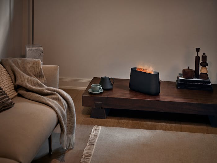 Ben humidifier by Stadler Form in black Ben humidifier by Stadler Form in black on a side table in a living room