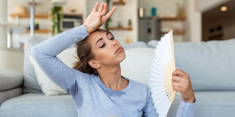 Woman sweating in her apartment