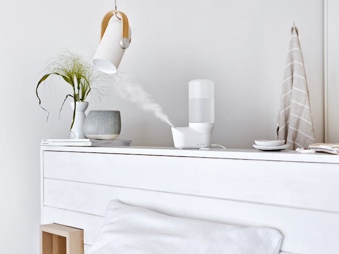 Emma personal humidifier by Stadler Form in white Emma personal humidifier by Stadler Form in white on a sideboard