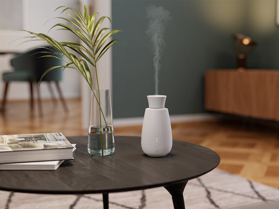 Aroma diffuser Ella by Stadler Form in a warm living room area on a table Aroma diffuser Ella by Stadler Form in a warm living room area on a table