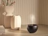 Jasmine mobile aroma diffuser in black on a sideboard