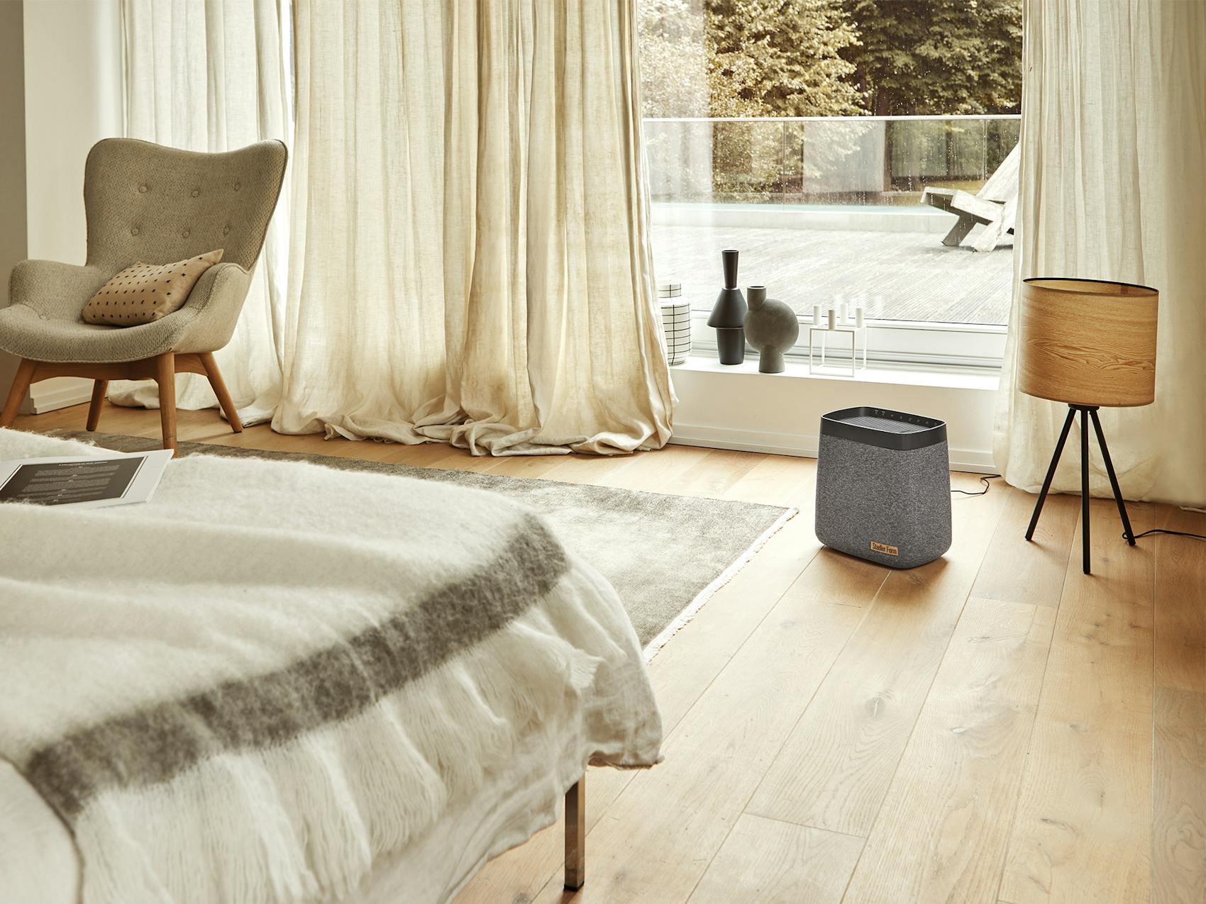 Karl humidifier by Stadler Form in a bed room