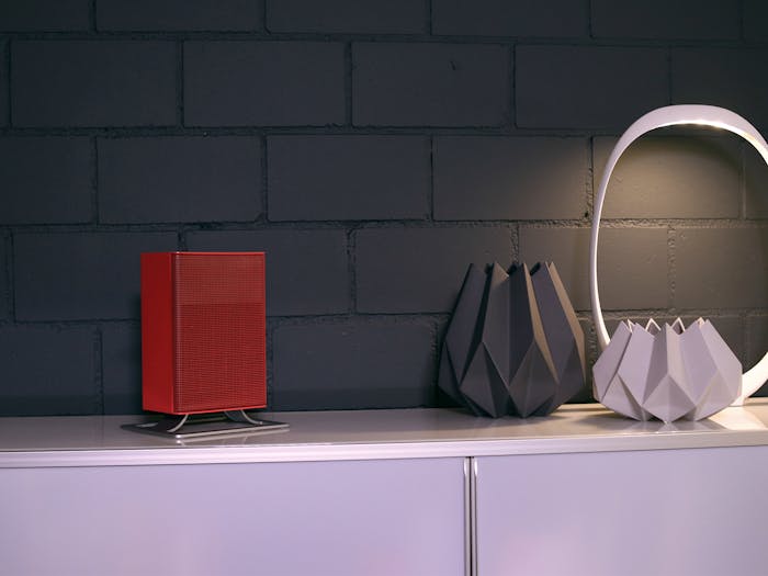 Anna little heater by Stadler Form in chili red on a sideboard
