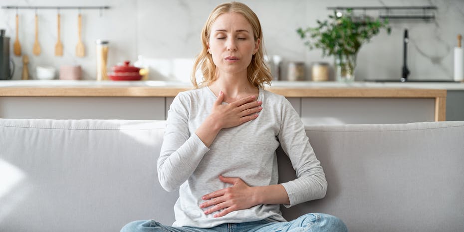 Women takes a deep breath