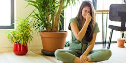 Woman sitting on the ground and bad smell