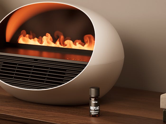 Gros plan sur le radiateur soufflant Erik et l'huile parfumée Fireplace dans une ambiance chaleureuse