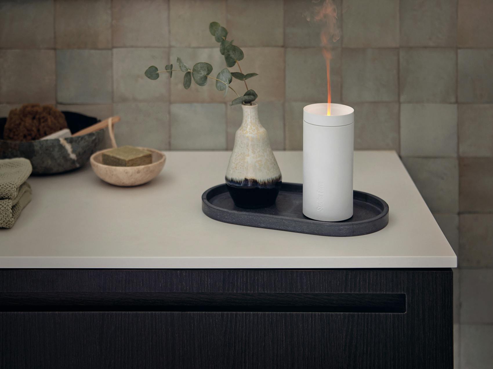 Lucy aroma diffuser by Stadler Form in white in a bathroom