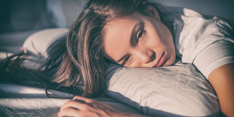 Tired woman in bed Müde Frau im Bett