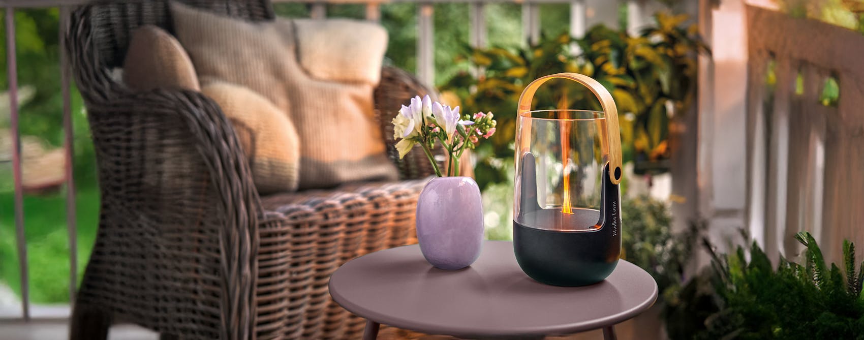 Stadler Form Sophie little aroma diffuser and lantern on a little table of a terrace