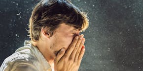 Young man sneezes in the dust Young man sneezes in the dust
