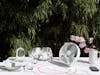 Tim table fan by Stadler Form in white on a outdoor dining table
