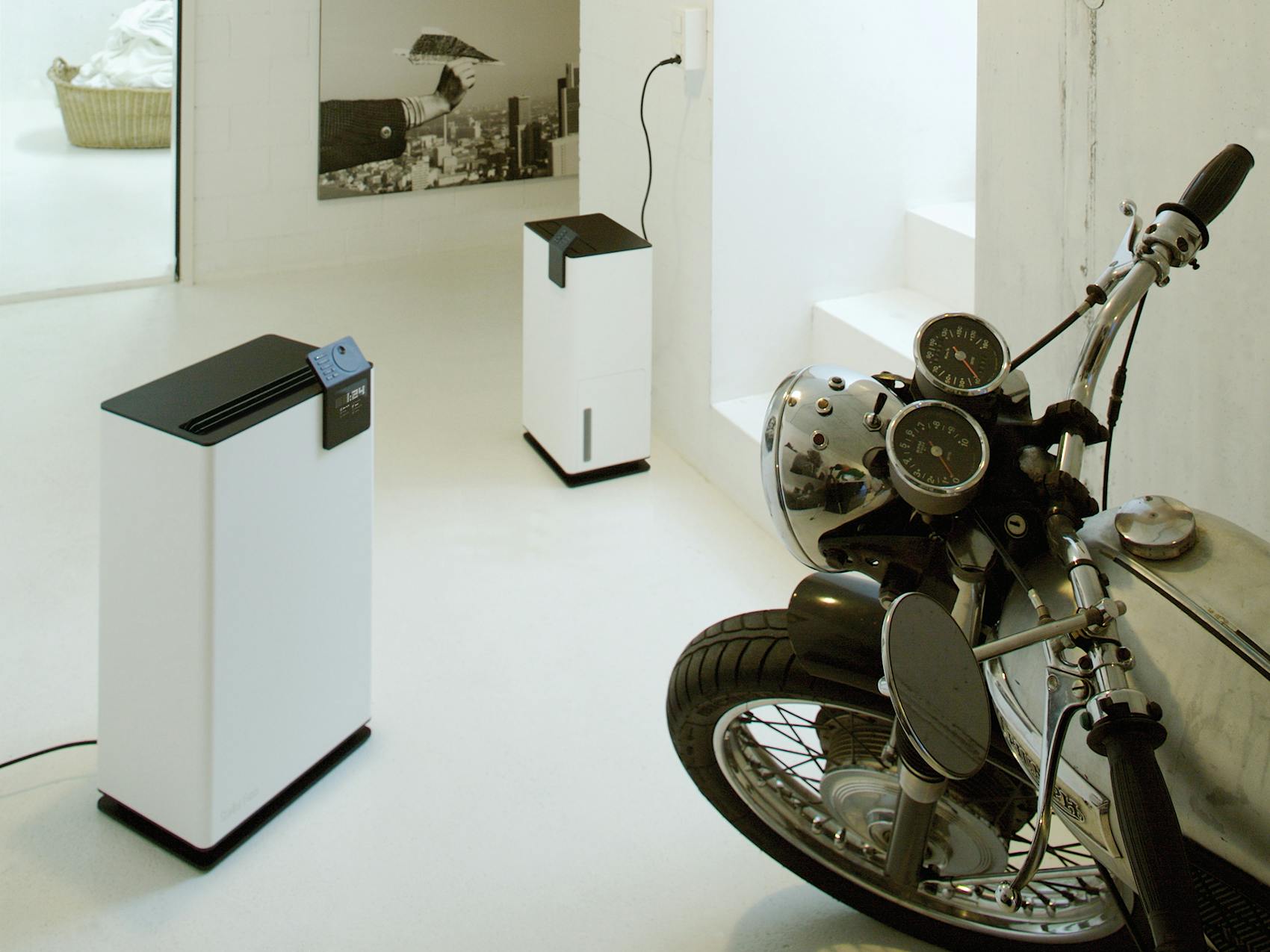 Albert and Albert Little dehumidifiers by Stadler Form Albert and Albert little by Stadler Form in a motorcycle garage