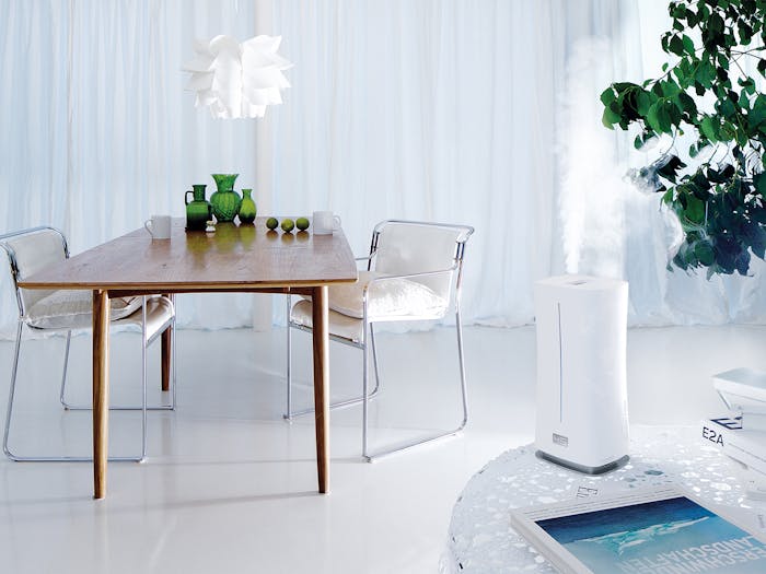 Eva little humidifier by Stadler Form in white in a living room on a table