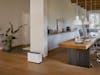 Stadler Form Noah Pro humidifier in the home office Noah Pro humidifier by Stadler Form next to a long solid wood desk with two workstations.