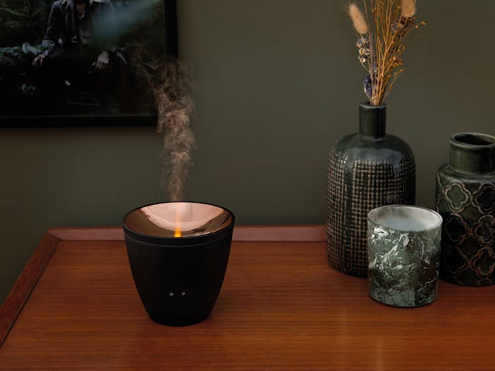 Zoe aroma diffuser by Stadler Form in black as decoration on a sideboard