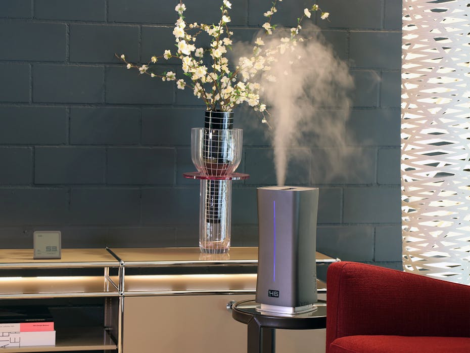 Eva little humidifier by Stadler Form in titanium on a side table