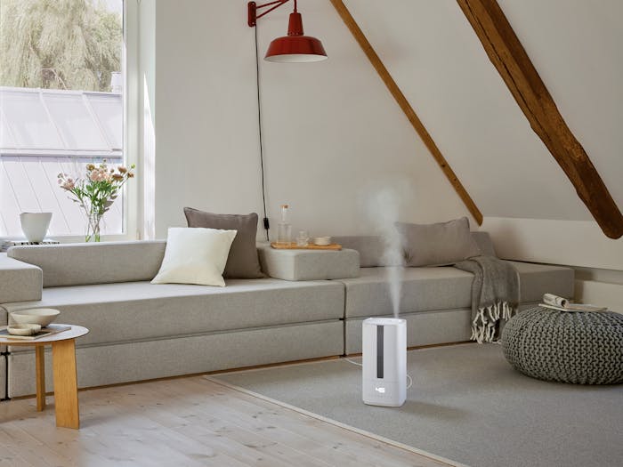 Oliver humidifier by Stadler Form in a livingroom area